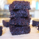 Sweet Potato Brownies Cut and placed in a stack with others around it.