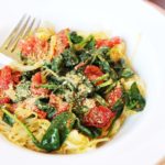 Spaghetti Squash with Spinach, Basil and Tomatoes in a white bowl