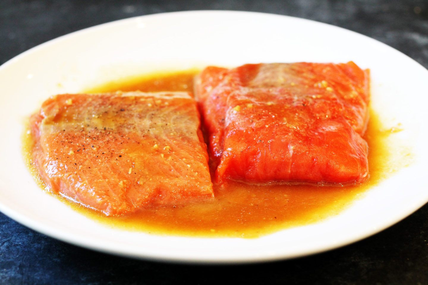 salmon in marinade on plate