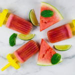 Watermelon Mojito Popsicles with watermelon wedges and lime wedges