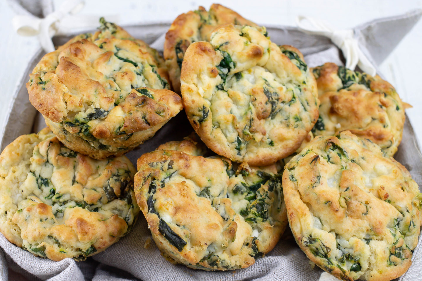 Make-Ahead Spinach Protein Muffins in a bread basket