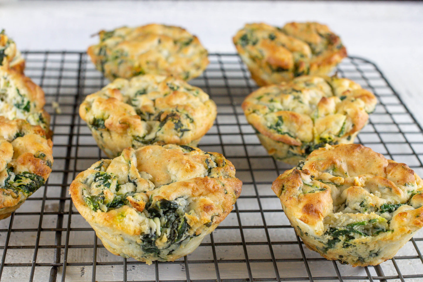 Spinach Protein Muffins on a cooling rack
