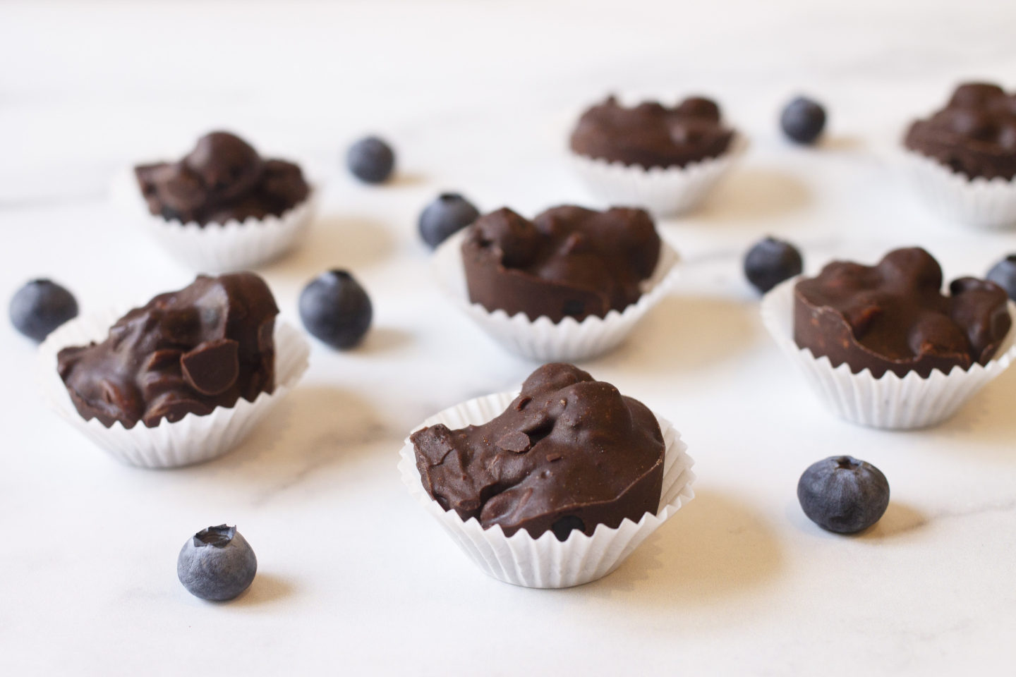 close up homemade chocolates with blueberries