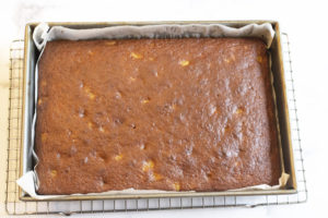 baked carrot cake cooling in pan