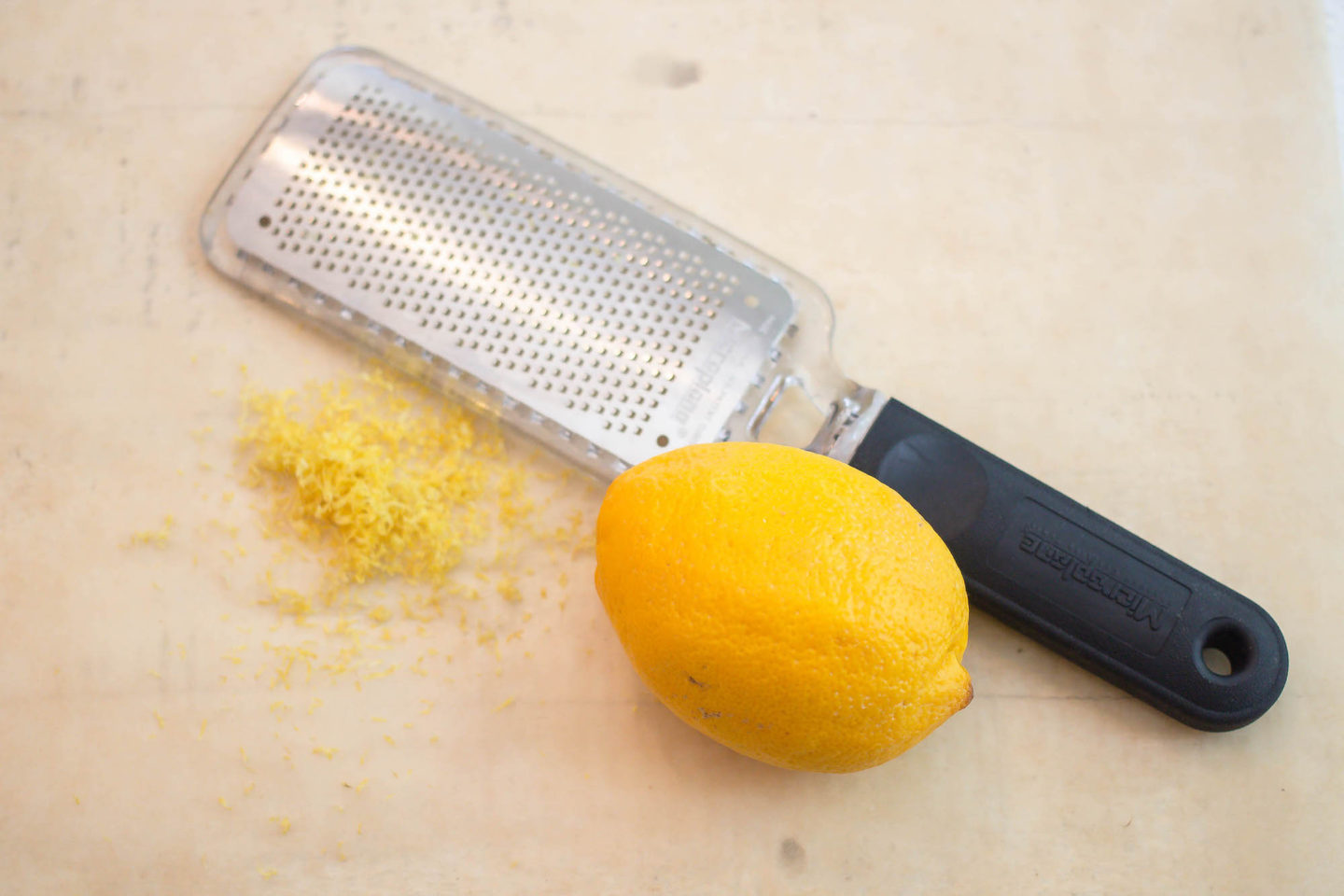 Lemon with zest and zester