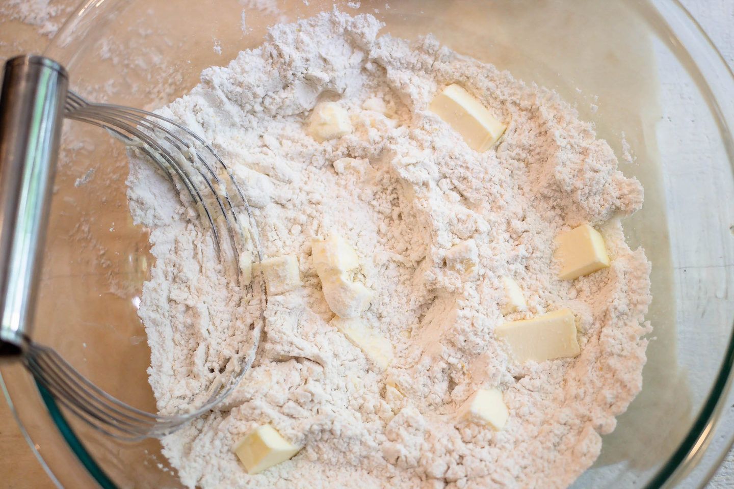 flour and butter for lemon scones with pastry cutter