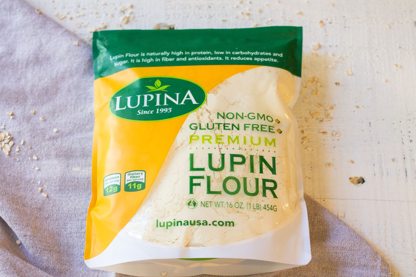 Bag of Lupin Flour laying on top of a gray napkin