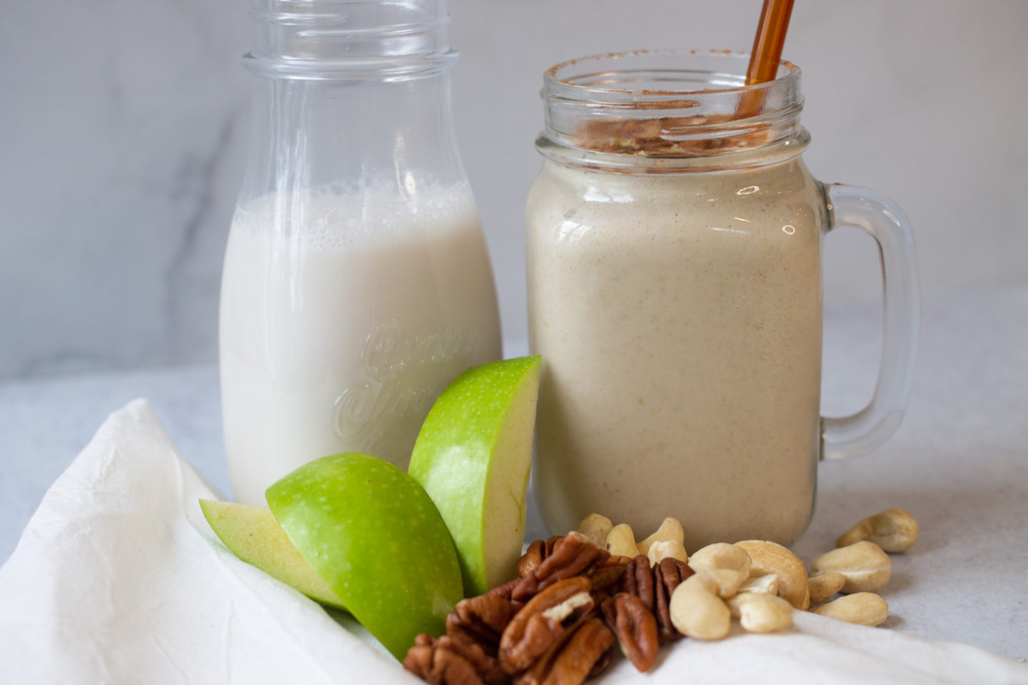 Apple Pie Smoothie with ingredients and a small milk jar