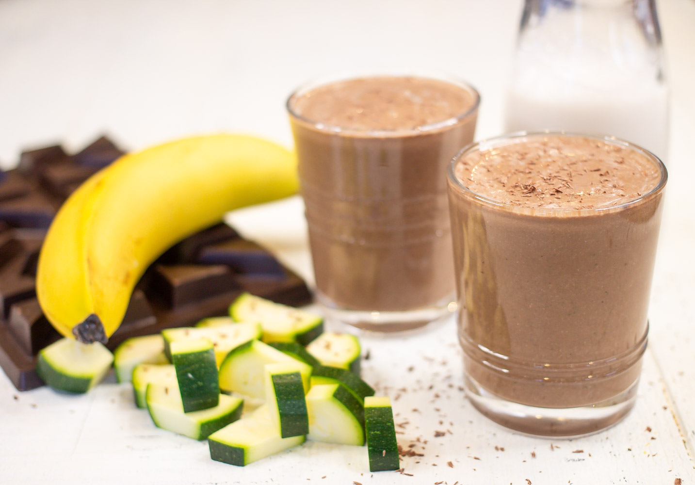 Chocolate Zucchini Bread Smoothie Low Sugar with ingredients and small milk jug