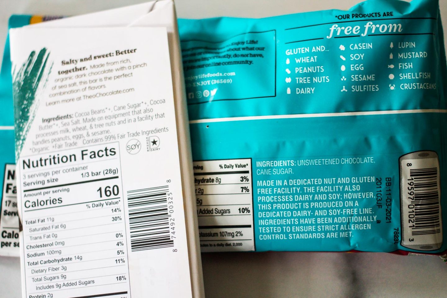 Back of one chocolate bar and a bag of chocolate chips to show ingredient list